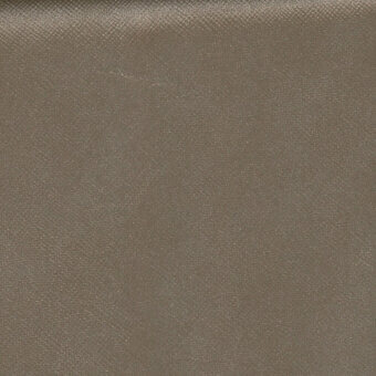 Leather upholstery swatch, medium brown, woven texture with matte finish and subtle grain, studio lighting.